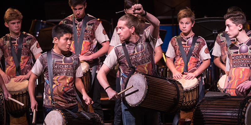 Jason Lee Bruns joins his World Drumming Ensemble students in performance