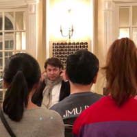 David Fray illustrates a concept by touching his ears as he chats with piano students after concert