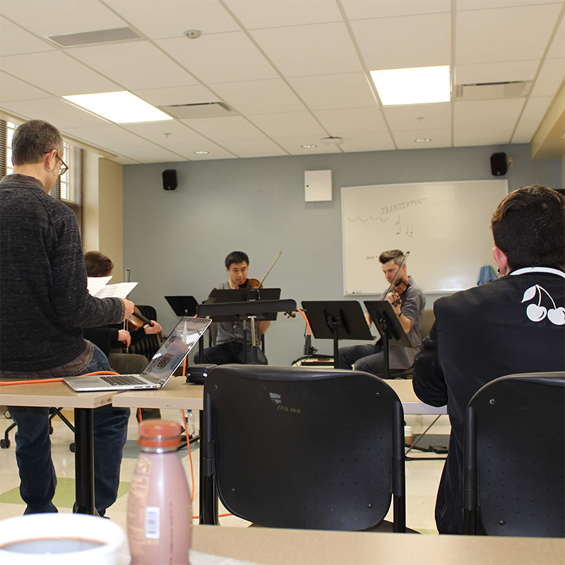 ETHEL working with Miami students in a music classroom