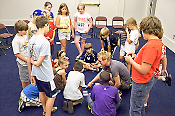 group of students learning card tricks