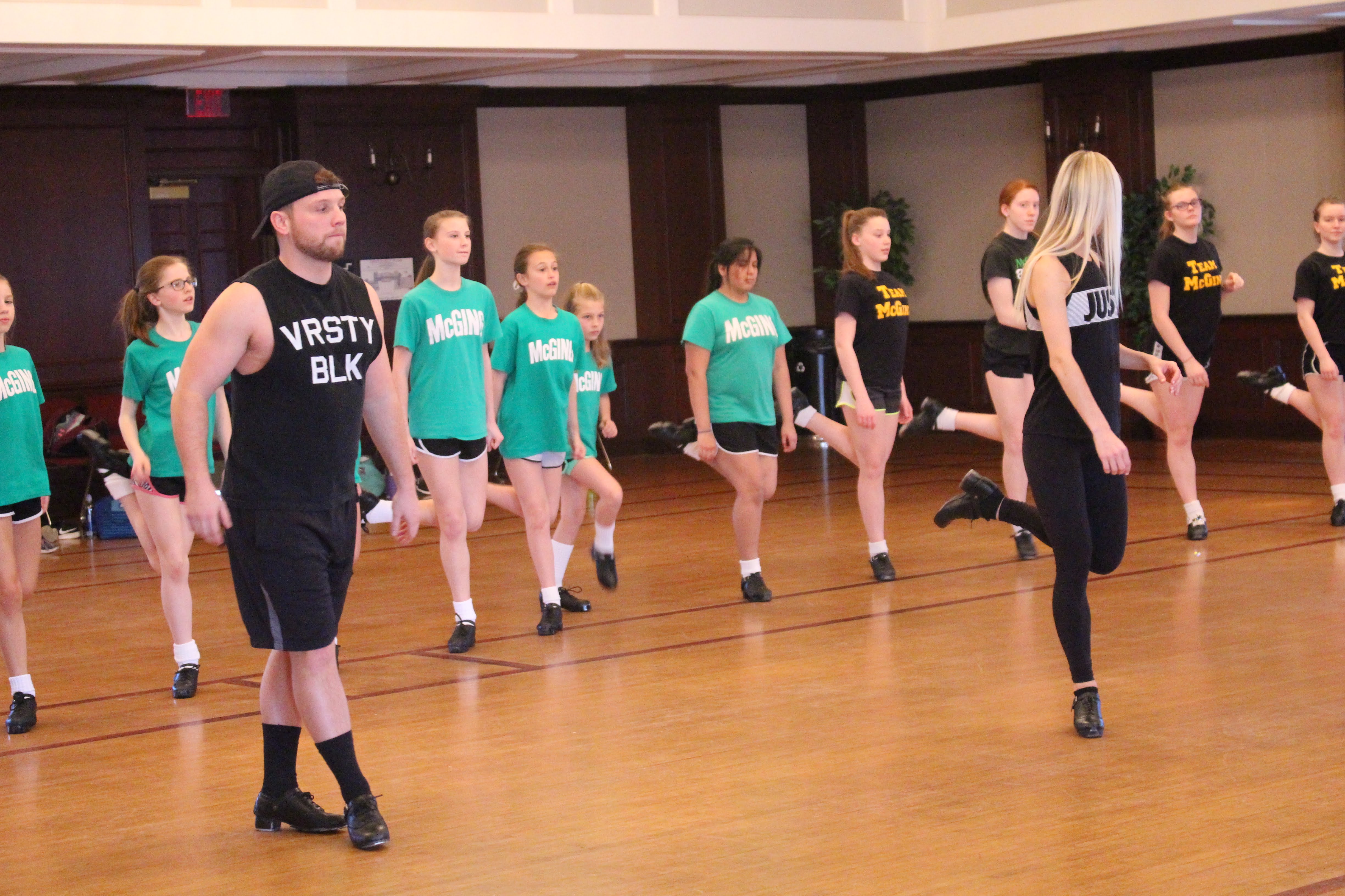 Dancers from Rockin' Road to Dublin teaching dance to young students from McGing Irish Dance School
