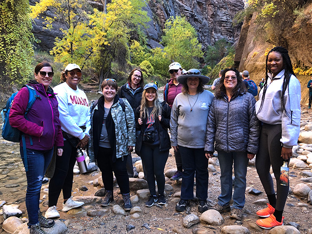 a group of students at zion national park canyon