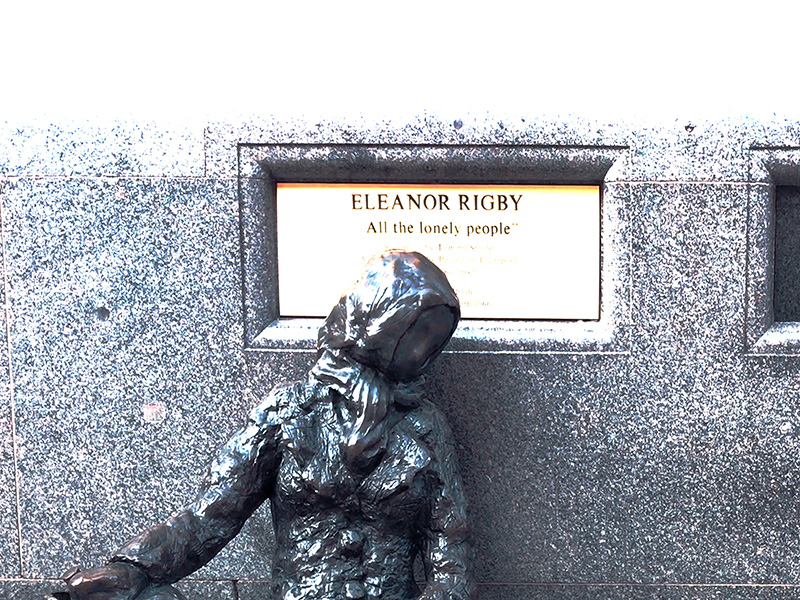 A photo of the iconic statue Eleanor Rigby situated on a bench in Liverpool, England