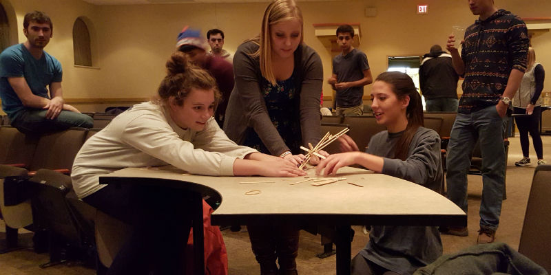3 students launch a self-build catapult during engineers week