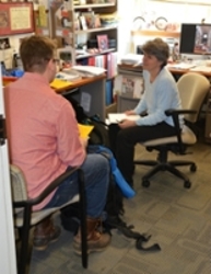 Dr. Almquist advising a student in her office