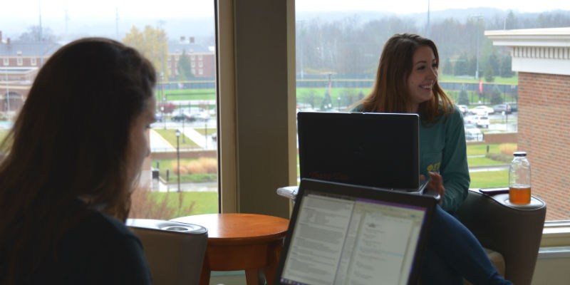  Female students studying in Benton Hall
