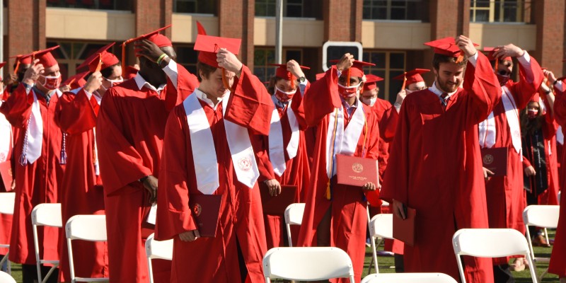 Students moving their tassels during graduation