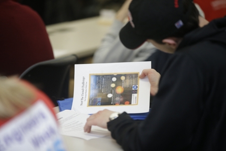 Boy looking at welcome packet