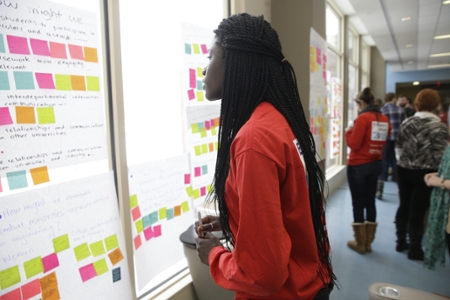 Girl looking at post-it notes