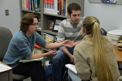 Dr. Sparks speaking with two students in her office