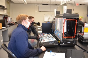 Two male students working on a process control lab