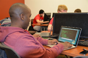Student codes on laptop