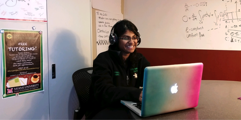 Student wearing a headset while working on a computer