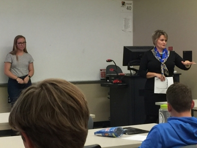 Karen Moss talks in front of students during the Listening Workshop
