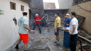 Students tearing down a structure at the Bethany Children's House