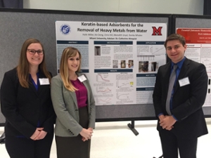 Halle (center) presenting her senior project