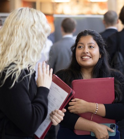 Two female students at the STEM job fair.