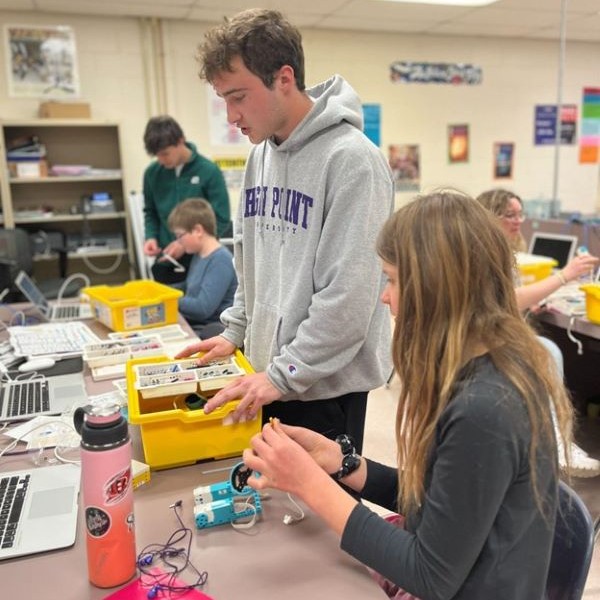 A male student working with a female student.