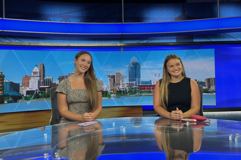 Students sitting at channel 5 news desk