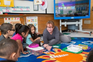 teacher with young students