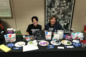 people smiling at booth