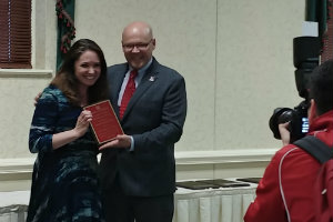 sharon custer receiving award