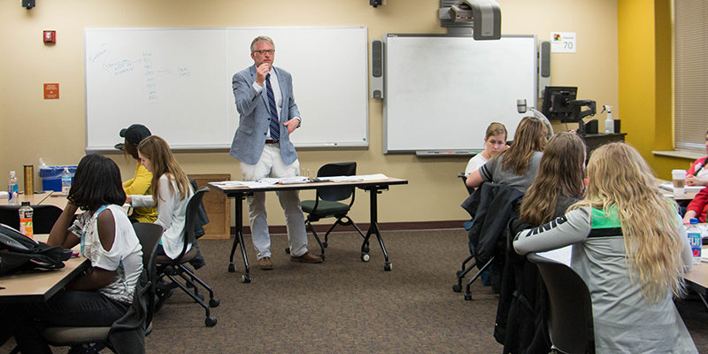 Teacher Education Professor Thomas Misco engages his students in a discussion