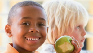 kid eating an apple