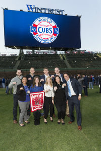 Zubrod poses with a group at Wrigley Field