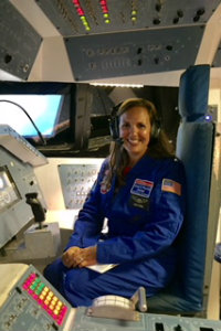Jackie O'Brien sits in cockpit of space shuttle
