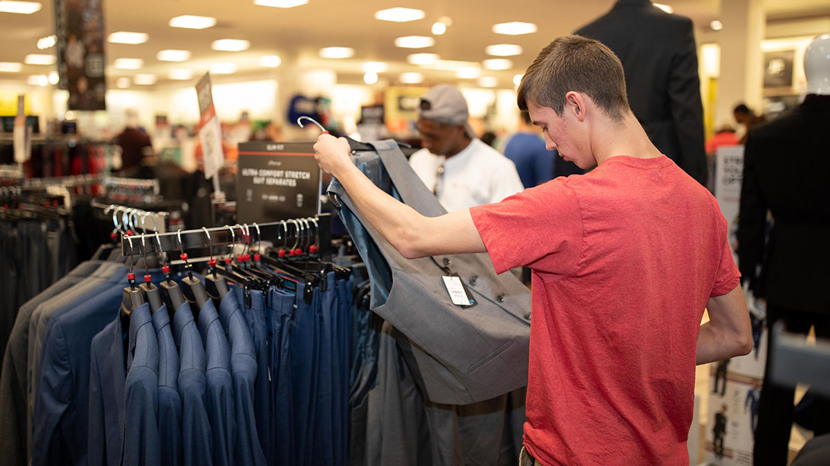 Students choosing clothes for Suit-Up