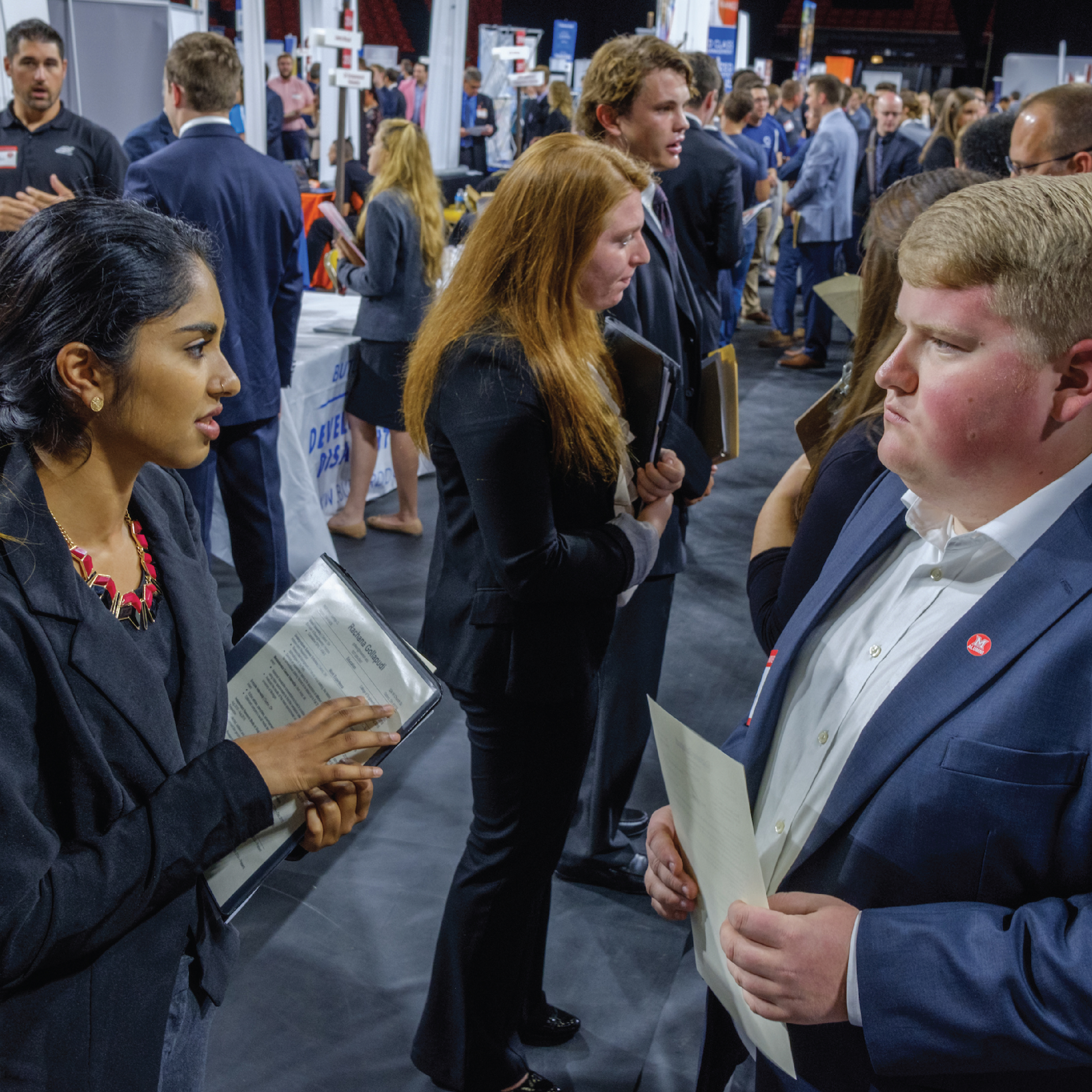 Students stand at a Career Fair in Millett Hall.