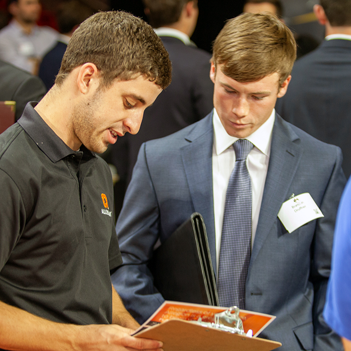 Student pitching an employer at Career Fair