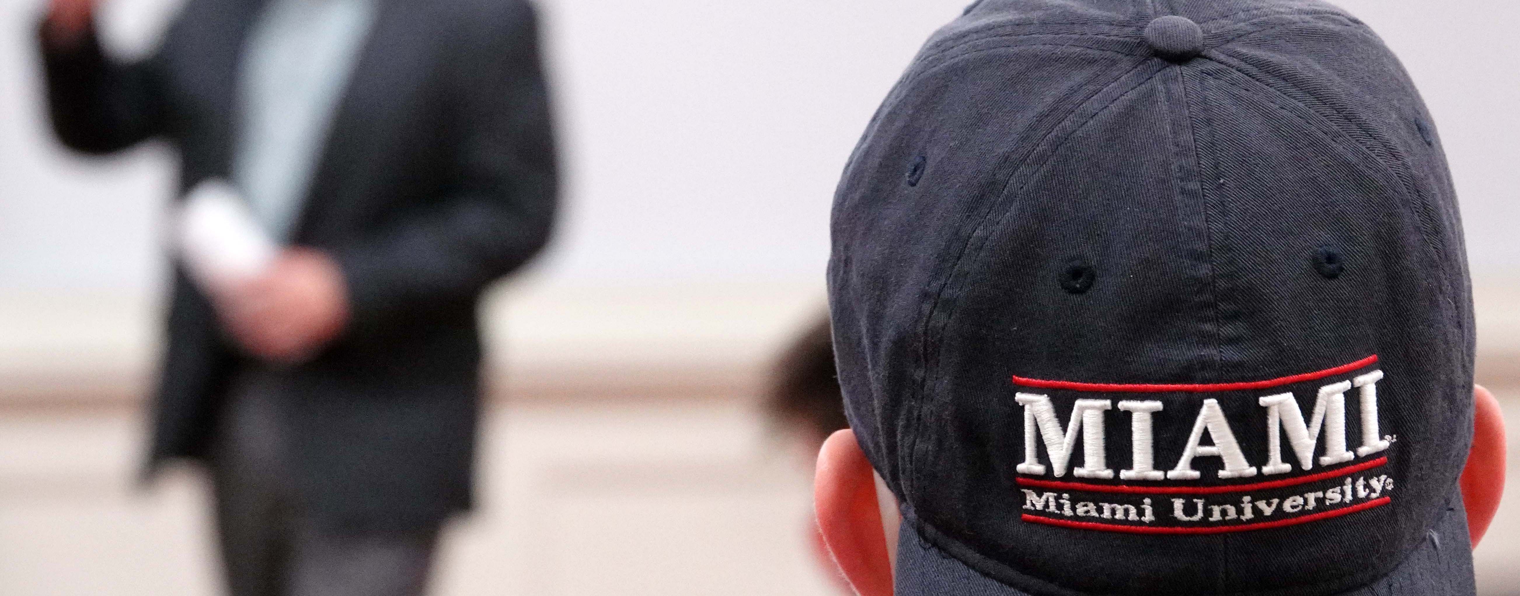 Miami University hat on student's head backward