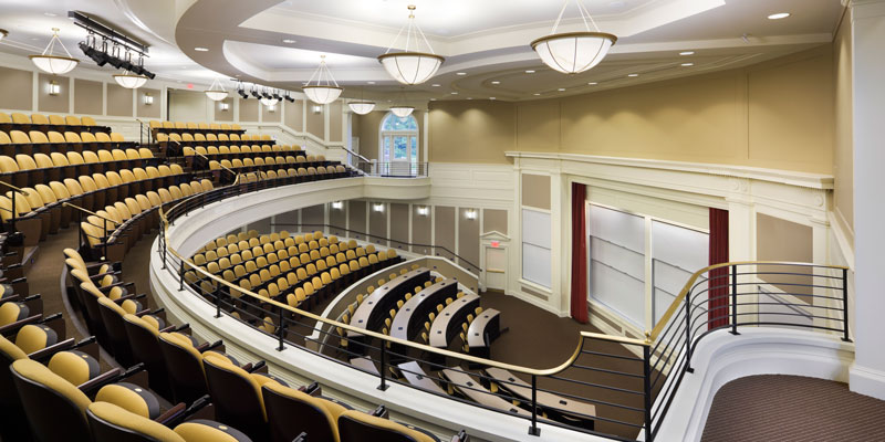 Taylor Auditorium from above. View of a half-circle auditorium with yellow chairs.