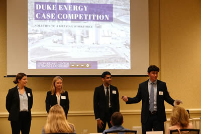 4 students giving duke energy case competition