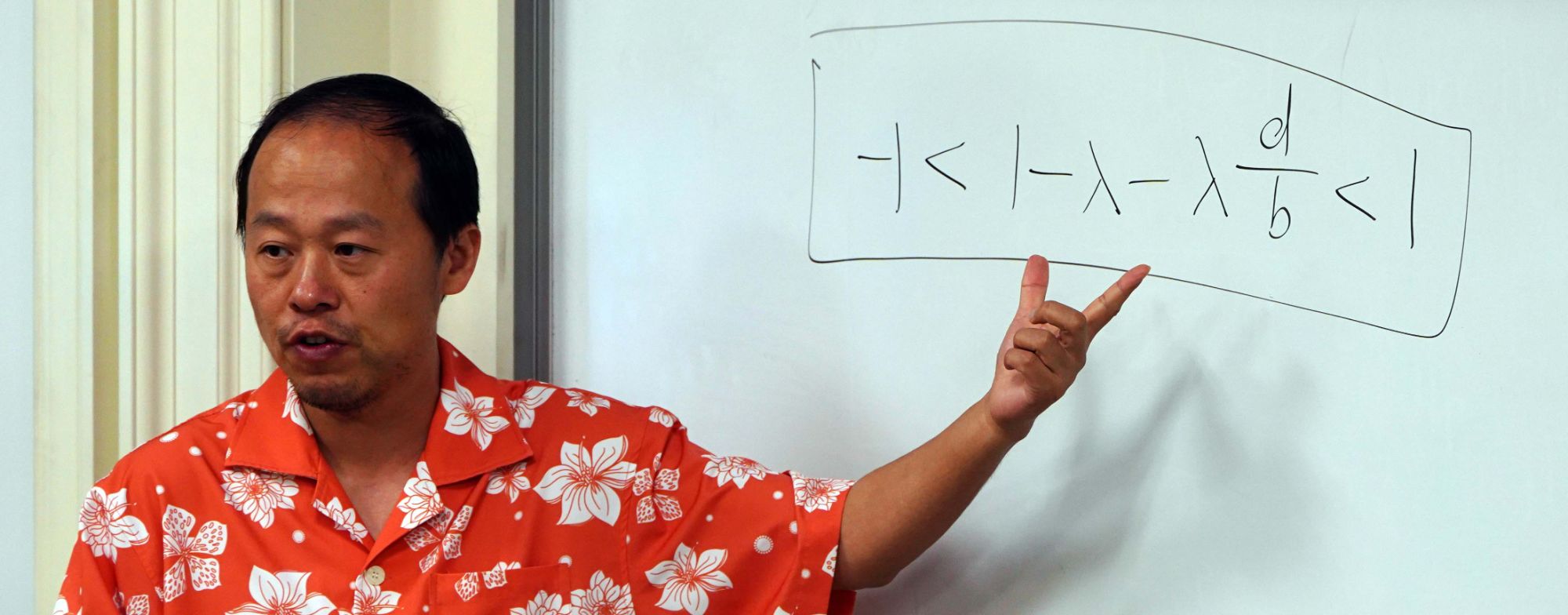  Jing Li points to equation on whiteboard