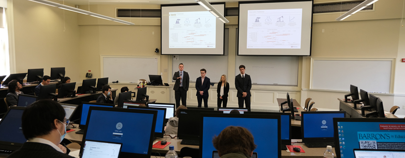 four students giving presentation
