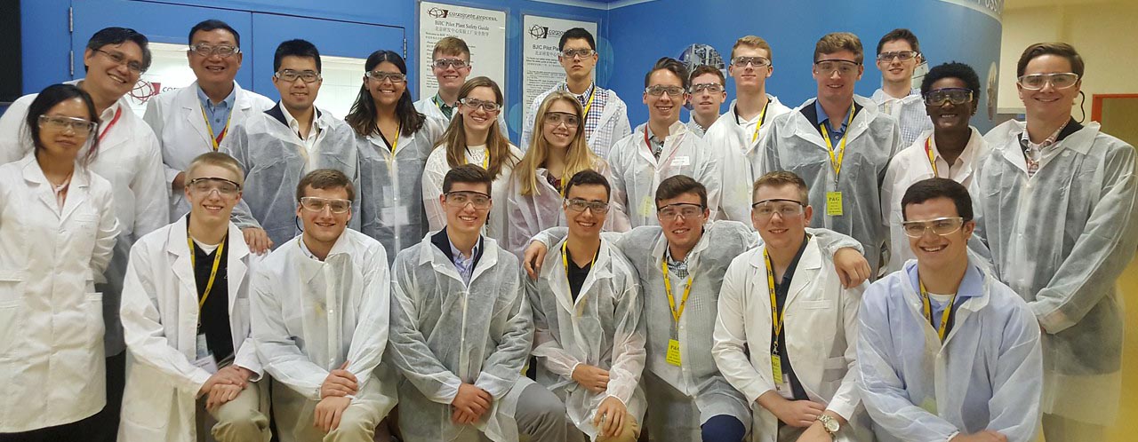  Students at lab in Asia, wearing protective clothing