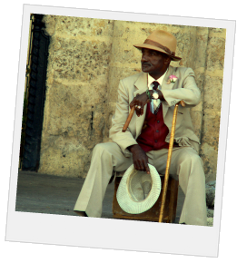 Cuban man sitting with a hat