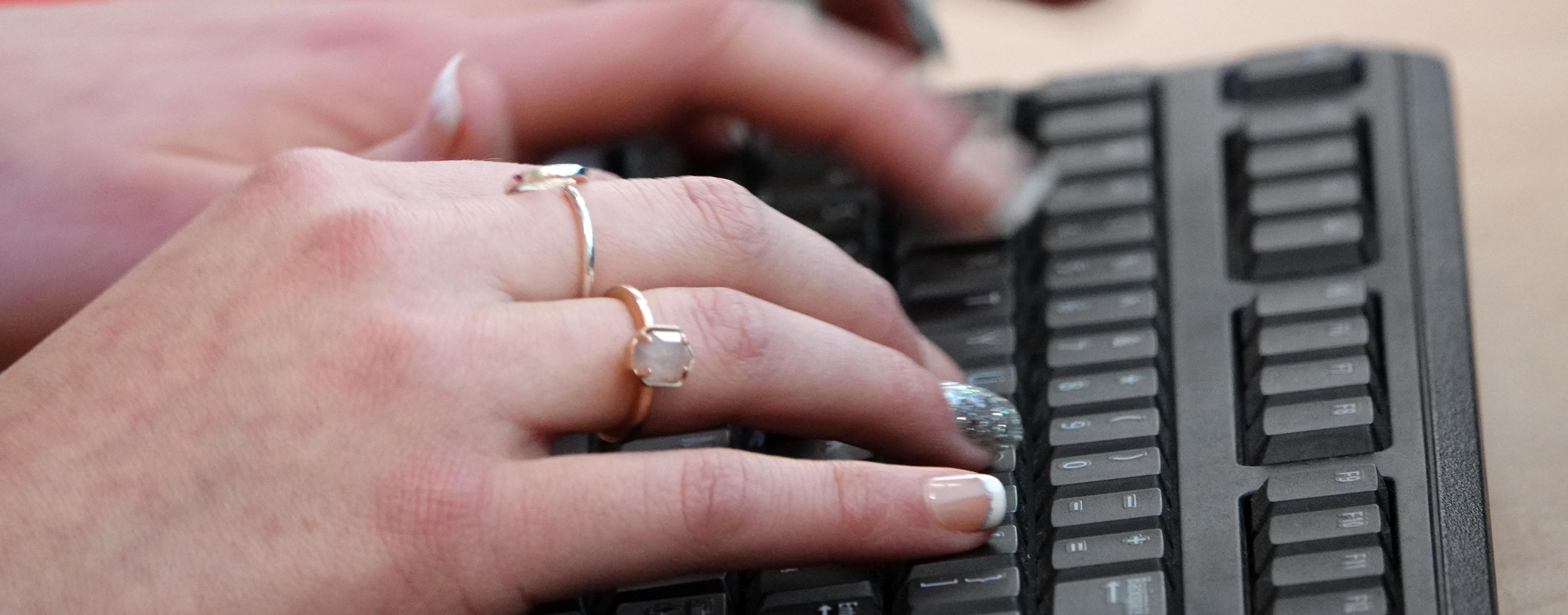  Woman's hands on keyboard