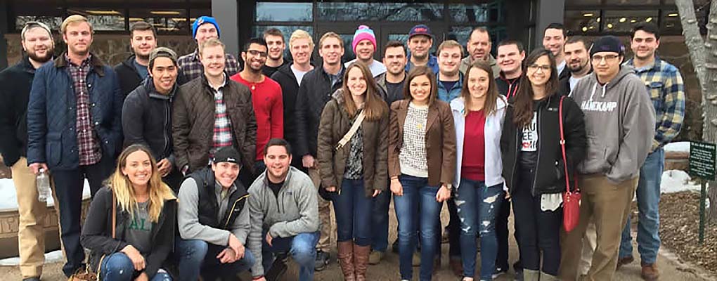  Students on brewery tour pose outside brewery