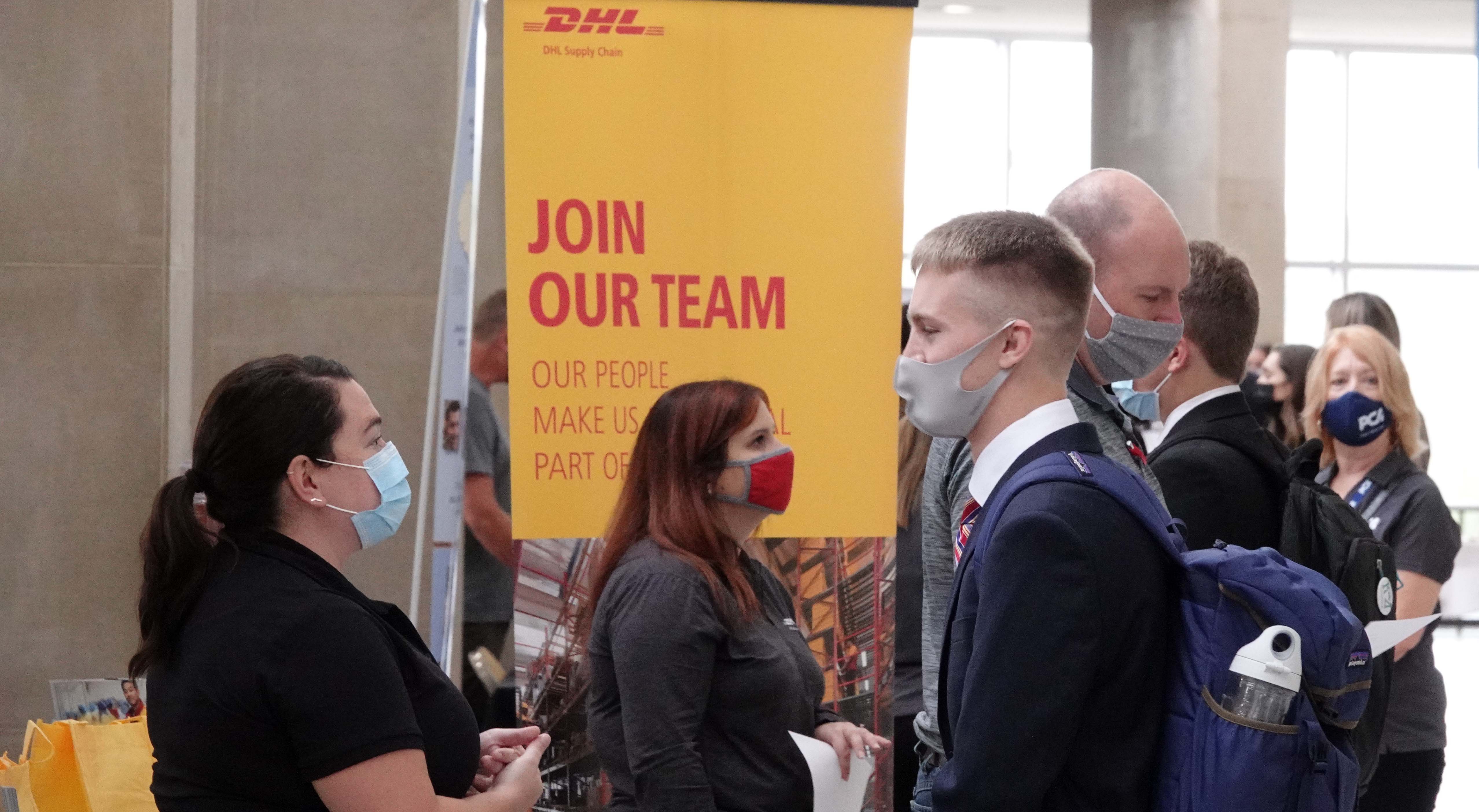 Recruiter and student talk at DHL booth