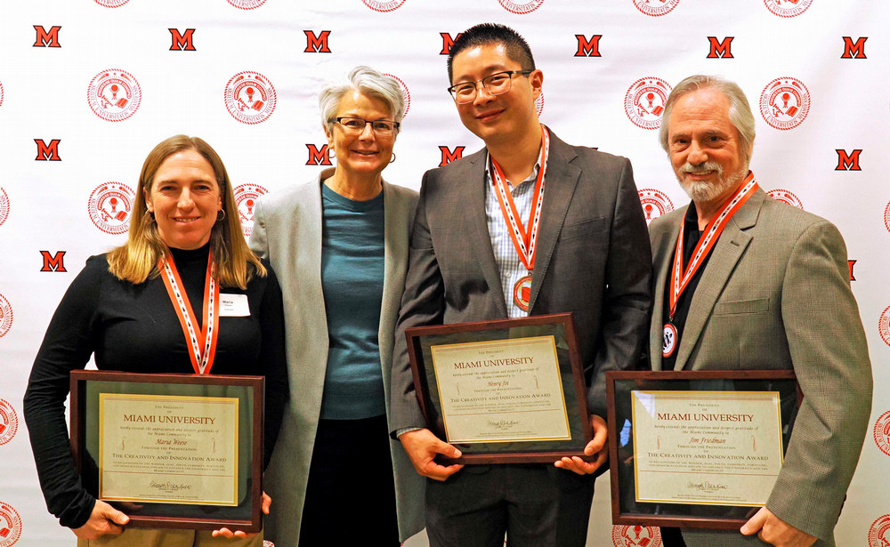 (L-R) Maria Weese, Farmer School dean Jenny Darroch, Henry Jin, and Jim Friedman