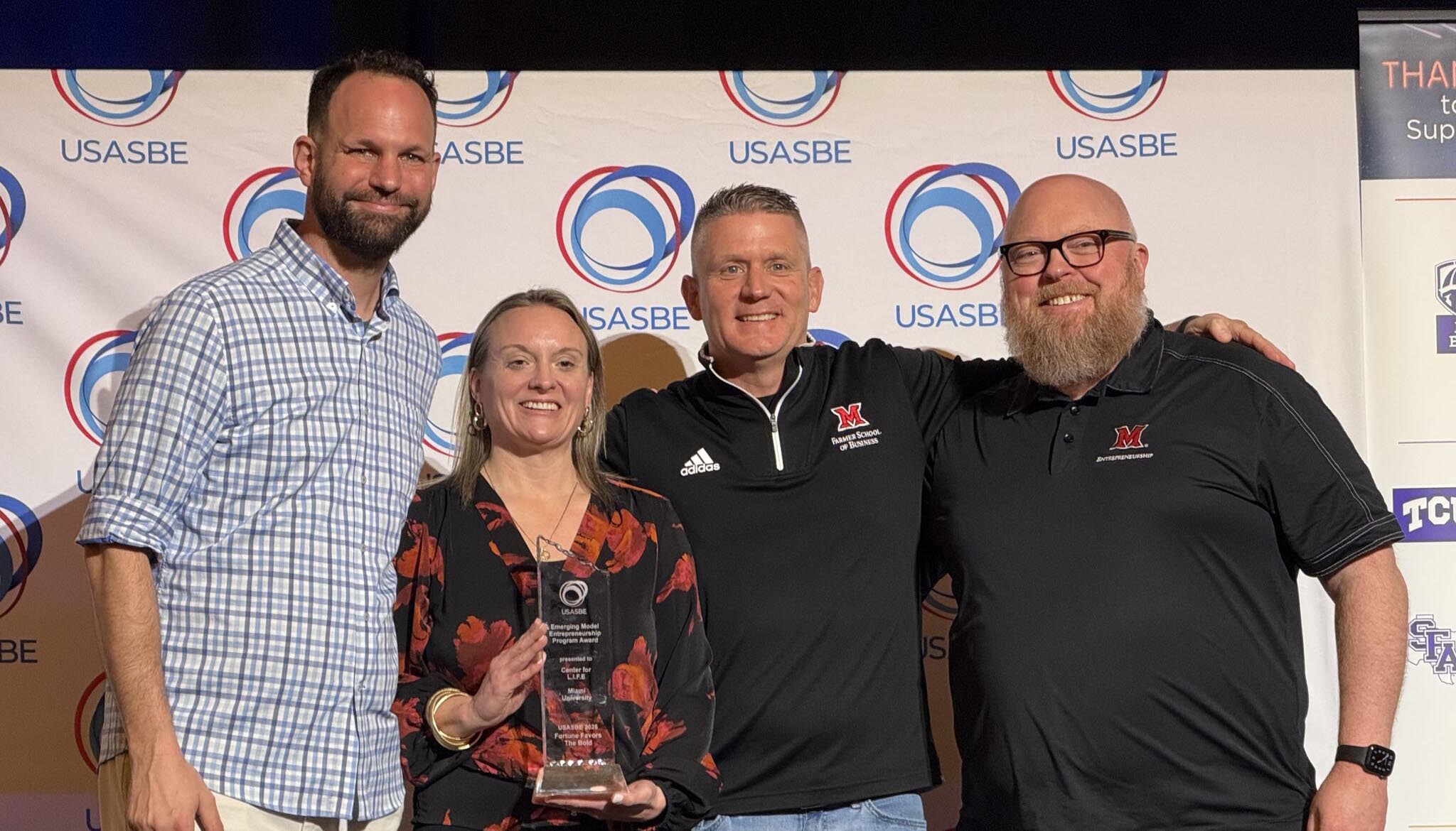 Members of the Center for L.I.F.E. pose with the award