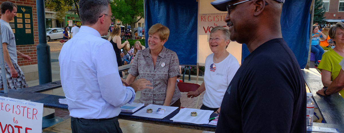 League of women voters table with visitors
