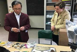 Dr. Gao presenting stone tools from Zhoukoudian site