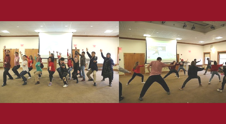 Students practicing martial arts with kung fu instructor, Yazhou Song