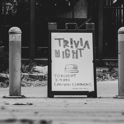 A street sign reading "virtual trivia"