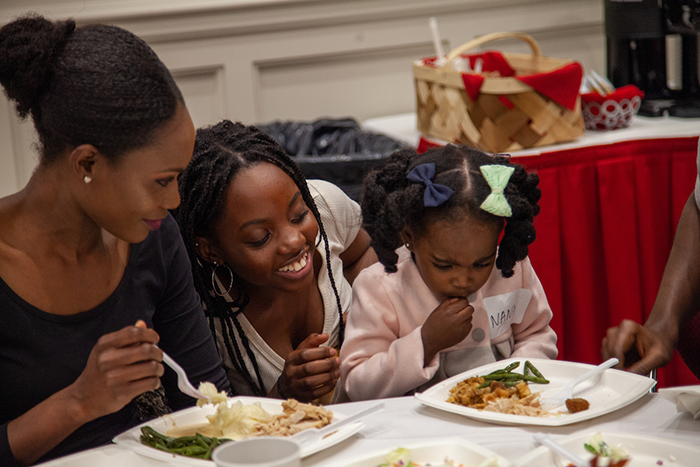 a family at an international dinner event